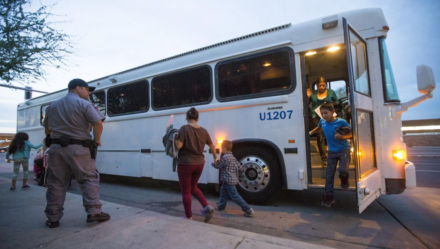 FILE - In this May 28, 2014, file photo, migrants are released from ICE custody at a Greyhound bus station in Phoenix. A Customs and Border Protection memo dated Jan. 28, 2020, obtained by The Associated Press confirms that bus companies such as Greyhound do not have to allow Border Patrol agents on board to conduct routine checks for illegal immigrants, despite the company&#39;s insistence that it has no choice but to do so. (Michael Chow/The Arizona Republic via AP, File)