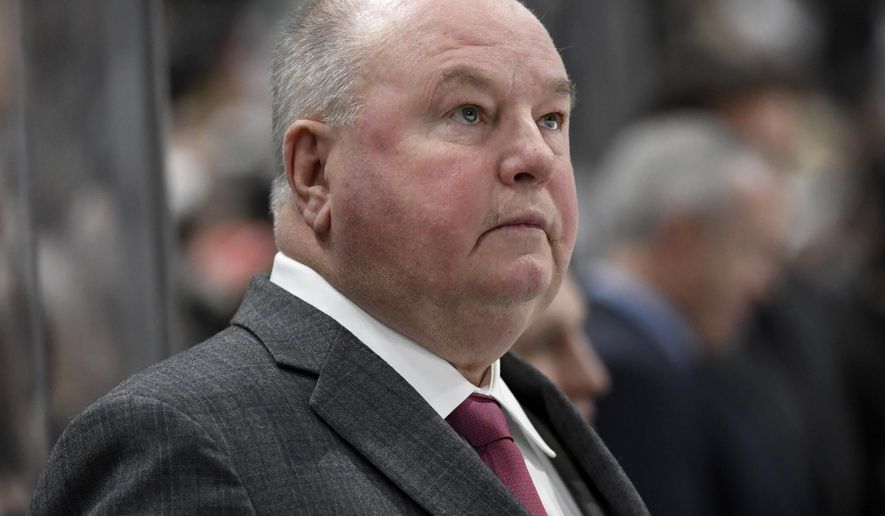 Minnesota Wild head coach Bruce Boudreau watches from the bench as his team plays against the Tampa Bay Lightning during the second period of an NHL hockey game Thursday, Jan. 16, 2020, in St. Paul, Minn. (AP Photo/Hannah Foslien)