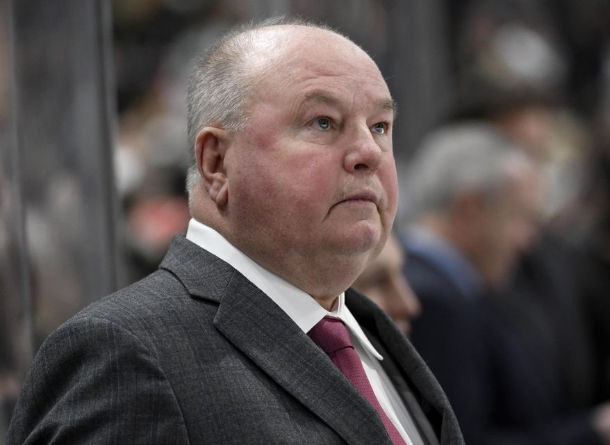 Minnesota Wild head coach Bruce Boudreau watches from the bench as his team plays against the Tampa Bay Lightning during the second period of an NHL hockey game Thursday, Jan. 16, 2020, in St. Paul, Minn. (AP Photo/Hannah Foslien)