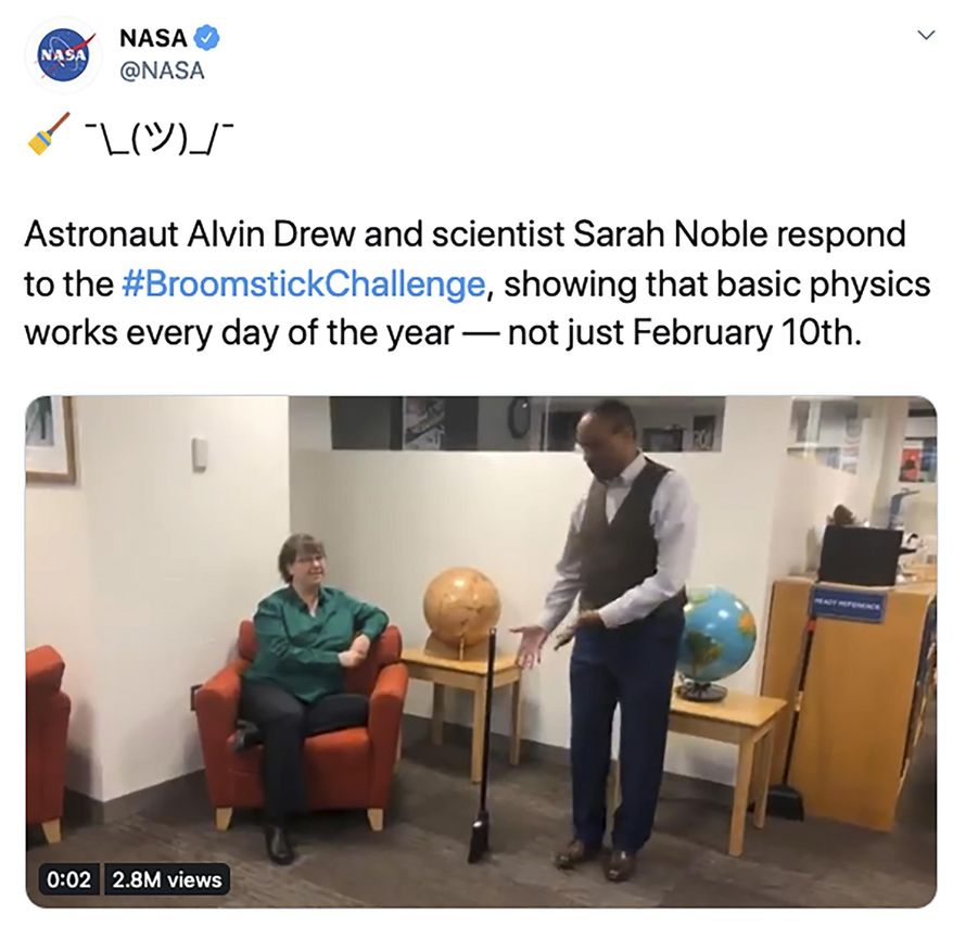 In this screenshot from NASA's Twitter account that was posted on Tuesday, Feb. 11, 2020, astronaut Alvin Drew and scientist Sara Noble demonstrate that a broom will stand up any day of the year, debunking the myth that the physics behind the simple trick only works on Feb. 10. (NASA/Twitter via AP)