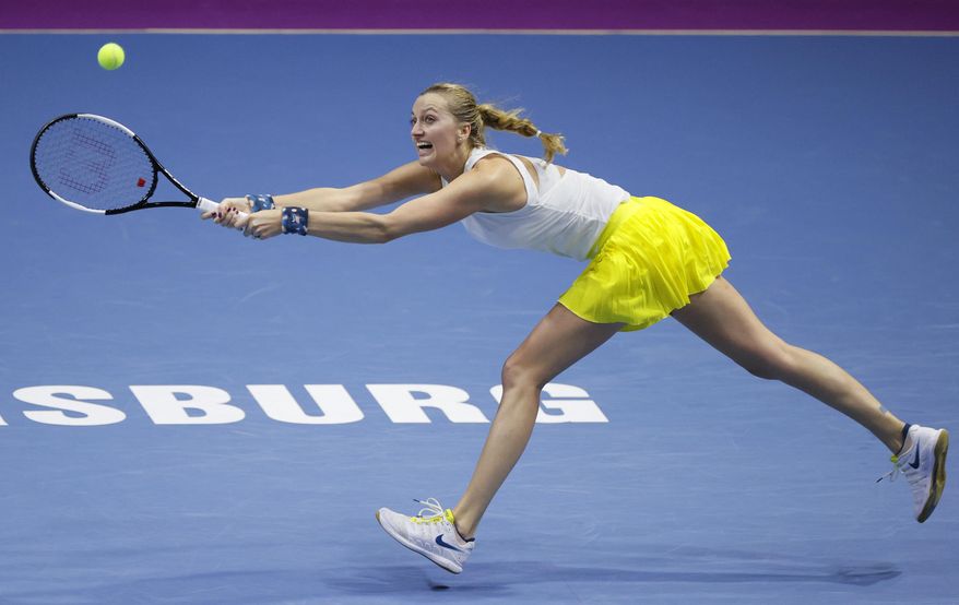 Petra Kvitova of Czech Republic returns the ball to Alison van Uytvanck of Belgium during the St. Petersburg Ladies Trophy-2020 tennis tournament match in St.Petersburg, Russia, Thursday, Feb. 13, 2020. (AP Photo/Dmitri Lovetsky)