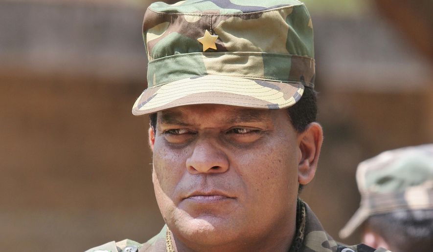FILE - This April 24, 2009, file photo shows Sri Lanka&#x27;s Lt. Gen. Shavendra Silva at a military facility in Kilinochchi, Sri Lanka.  The U.S. government on Friday, Feb. 14, 2020,  issued a travel ban on Sri Lanka&#x27;s army chief, saying there is “credible information of his involvement” in human rights violations during the final phase of the island nation&#x27;s civil war that ended 11 years ago, Secretary of State Michael R. Pompeo said.  Silva, and his immediate family members are now prohibited from traveling to the U.S. in a ban that was quickly denounced by Sri Lanka&#x27;s government, which said “there were no substantiated or proven allegations of human rights violations&amp;quot; committed by Silva.(AP Photo/Chamila Karunarathne, File)