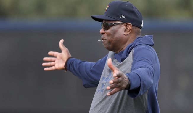 Houston Astros manager Dusty Baker gestures as he watches his team during spring training baseball practice Thursday, Feb. 13, 2020, in West Palm Beach, Fla. (AP Photo/Jeff Roberson)