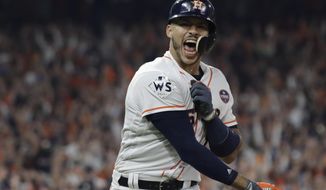 FILE - In this Oct. 29, 2017, file photo, Houston Astros&#39; Carlos Correa celebrates his two-run home run during the seventh inning of Game 5 of baseball&#39;s World Series against the Los Angeles Dodgers in Houston. While the Astros have been punished by Major League Baseball for a sign-stealing scheme in their run to the 2017 championship, and Correa says Houston won that World Series “fair and square.” (AP Photo/David J. Phillip, File)
