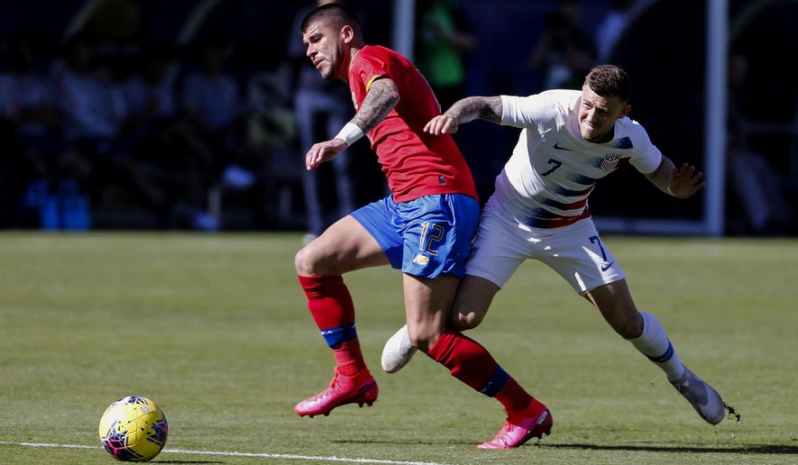 Costa Rica midfielder Ulises Segura (12) and United States forward Paul Arriola (7) vie for the ball during the first half of an international friendly soccer match in Carson, Calif., Saturday, Feb. 1, 2020. (AP Photo/Ringo H.W. Chiu)