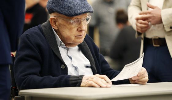 Former U.S. Sen. Harry Reid fills out his ballot at an early voting site at the East Las Vegas library, Saturday, Feb. 15, 2020, in Las Vegas. (AP Photo/John Locher)
