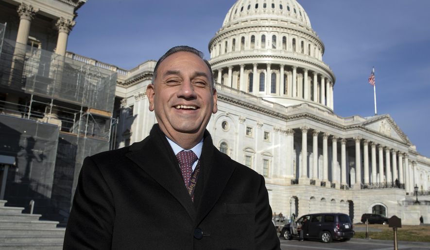 FILE - In this Nov. 29, 2018, file photo, then-Rep.-elect Gil Cisneros, D-Calif., stands in front of the Capitol during a week of orientation for incoming members, in Washington. Republicans are eager to recapture a string of California U.S. House seats a that the party lost in a 2018 rout, but the job is looking tougher: The numbers are running against them. State voter registration statistics show Democrats gaining ground in key battleground districts that the party seized two years ago, on its way to regaining control of the House. (AP Photo/J. Scott Applewhite, File)