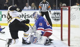 New York Rangers goaltender Alexandar Georgiev (40) makes a save against Boston Bruins left wing Jake DeBrusk (74) during the first period of an NHL hockey game, Sunday, Feb. 16, 2020, at Madison Square Garden in New York. (AP Photo/Mary Altaffer