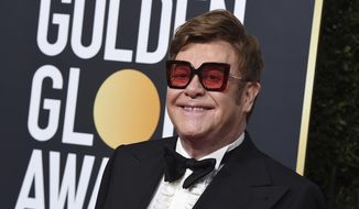 FILE - In this Jan. 5, 2020 file photo, Elton John arrives at the 77th annual Golden Globe Awards at the Beverly Hilton Hotel, in Beverly Hills, Calif. An emotional John had to cut short a performance in New Zealand on Sunday, Feb. 16 after he lost his voice due to walking pneumonia and had to be assisted off stage.  John reached out to his fans on Instagram on Sunday, apologizing for ending his show at Auckland&#39;s Mt Smart Stadium early.  (Photo by Jordan Strauss/Invision/AP, File)