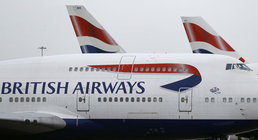 FILE - In this Tuesday, Jan. 10, 2017, file photo, British Airways planes are parked at Heathrow Airport in London. A British Airways plane flew between New York and London in less than five hours, landing early Sunday, Feb. 9, 2020, at Heathrow Airport after leaving John F. Kennedy International Airport, setting a record for subsonic plane travel. (AP Photo/Frank Augstein, File)