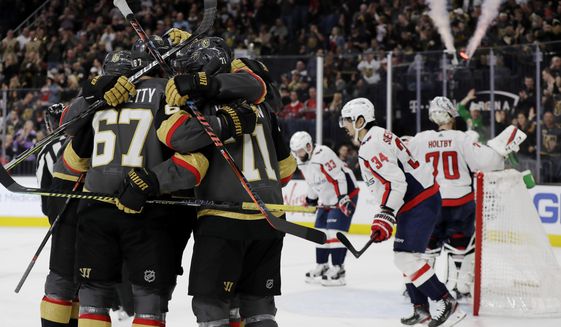 Vegas Golden Knights left wing Max Pacioretty (67) celebrates with teammates after scoring against the Washington Capitals during the second period of an NHL hockey game Monday, Feb. 17, 2020, in Las Vegas. (AP Photo/Isaac Brekken)