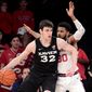 Xavier&#39;s Zach Freemantle (32) tries to get around the defense of St. John&#39;s LJ Figueroa during an NCAA college basketball game in New York on Monday, Feb 17, 2020. (Steven Ryan/Newsday via AP)