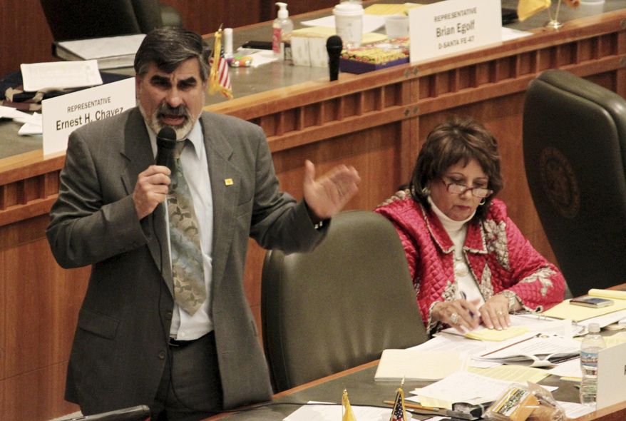 FILE - In this Feb. 10, 2010 file photo, state Rep. Rick Miera, D-Albuquerque, responds to questions about a proposed Hispanic Education Act during debate on the House floor in Santa Fe, N.M. Miera, who retired in 2015, told The Associated Press on Monday, Feb 17, 2020, he is considering running for the Senate seat currently held by Sen. John Sapien, who announced his retirement. (AP Photo/Susan Montoya Bryan, File)