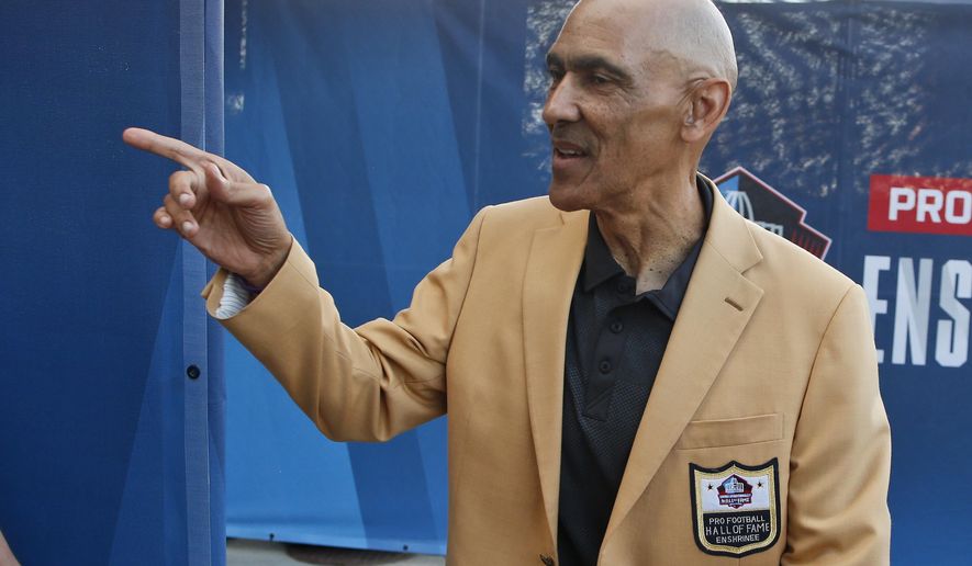 In this Aug. 3, 2019, file photo, former NFL player Tony Dungy is introduced before the induction ceremony at the Pro Football Hall of Fame in Canton, Ohio. Pro football is discovering that the spirit of the Rooney Rule is being violated.  NFL Commissioner Roger Goodell made that a point of emphasis in his state of the league speech during Super Bowl week. So count on Goodell finding ways to more strongly implement the policy that requires teams to interview minority candidates for coaching and executive positions.(AP Photo/Ron Schwane) ** FILE **