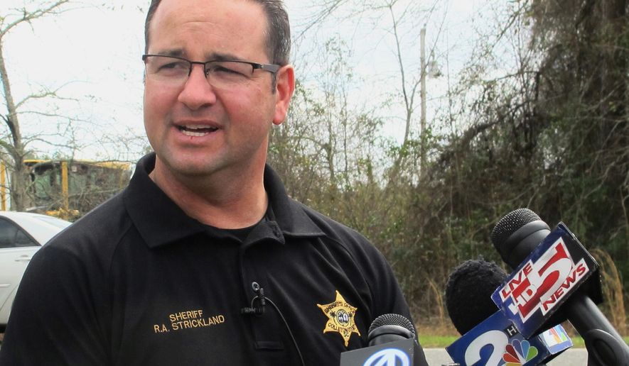 FILE - In this March 10, 2016 file photo, Colleton County Sheriff R.A. Strickland talks with members of the media about the search for multiple missing children near the community of Smoaks, S.C. The suspended South Carolina sheriff already indicted on domestic violence charges now faces additional criminal charges including giving alcohol to someone under 21 and using his power to continue a sexual relationship with an employee, authorities said. The new indictments against Strickland were unsealed Tuesday, Feb. 18, 2020. (AP Photo/Bruce Smith, File)