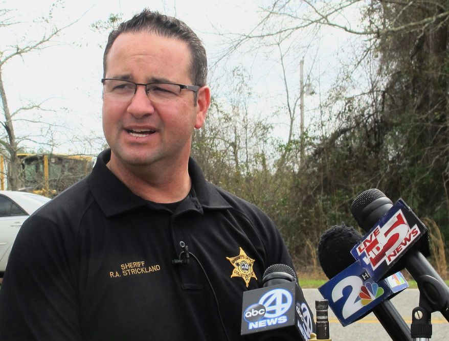 FILE - In this March 10, 2016 file photo, Colleton County Sheriff R.A. Strickland talks with members of the media about the search for multiple missing children near the community of Smoaks, S.C. The suspended South Carolina sheriff already indicted on domestic violence charges now faces additional criminal charges including giving alcohol to someone under 21 and using his power to continue a sexual relationship with an employee, authorities said. The new indictments against Strickland were unsealed Tuesday, Feb. 18, 2020. (AP Photo/Bruce Smith, File)
