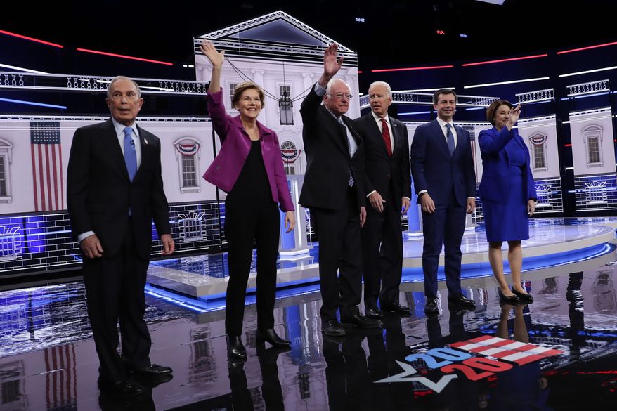 From left, Democratic presidential candidates, former New York City Mayor Michael Bloomberg, Sen. Elizabeth Warren, D-Mass., Sen. Bernie Sanders, I-Vt.,former Vice President Joe Biden, former South Bend Mayor Pete Buttigieg, Sen. Amy Klobuchar, D-Minn., stand on stage before a Democratic presidential primary debate Wednesday, Feb. 19, 2020, in Las Vegas, hosted by NBC News and MSNBC. (AP Photo/Matt York)