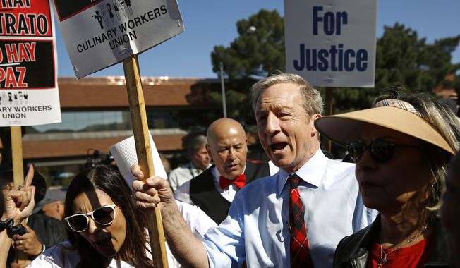 Democratic presidential candidate, businessman Tom Steyer walks on a picket line with members of the Culinary Workers Union Local 226 outside the Palms Casino in Las Vegas, Wednesday, Feb. 19, 2020. (AP Photo/Patrick Semansky)