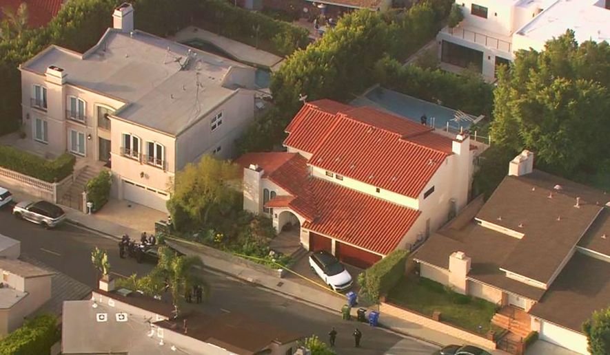 This aerial photo taken from video provided by Fox11 News KTTV-TV shows the Hollywood Hills home, center, where Pop Smoke, 20, was shot and killed early Wednesday, Feb. 19, 2020, in Los Angeles. Republic Records says in a statement that the label is devastated by the unexpected and tragic loss of the rapper. The shooting occurred before dawn Wednesday. Public listings show that the home which is a rental is owned by Edwin Arroyave and his wife Teddi Mellencamp, daughter of singer John Mellencamp and star of &quot;The Real Housewives of Beverly Hills.&quot; (Fox11 News KTTV-TV via AP)