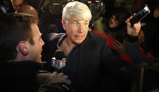 Former Illinois Gov. Rod Blagojevich tries to get into his house as he arrives home in Chicago on Wednesday, Feb. 19, 2020, after his release from Colorado prison late Tuesday. Blagojevich walked out of prison Tuesday after President Donald Trump cut short the 14-year prison sentence handed to the former Illinois governor for political corruption. (AP Photo/Charles Rex Arbogast)