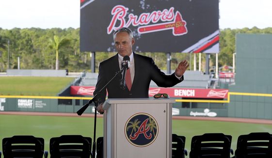 Baseball Commissioner Rob Manfred takes questions about the Houston Astros during a news conference at the Atlanta Braves&#39; spring training facility Sunday, Feb. 16, 2020, in North Port, Fla. (Curtis Compton/Atlanta Journal-Constitution via AP)