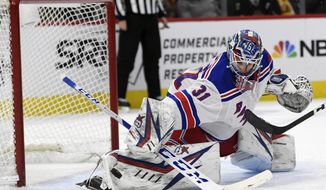 New York Rangers goalie Igor Shesterkin (31) of Russia, makes a save during the third period of an NHL hockey game against the Chicago Blackhawks Wednesday, Feb. 19, 2020, in Chicago. (AP Photo/Paul Beaty)