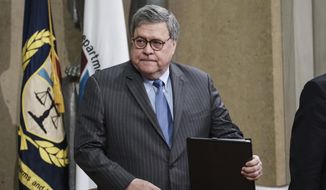 In this Jan. 22, 2020, file photo, Attorney General William Barr arrives for a ceremony at the Department of Justice in Washington, to announce the establishment of the Presidential Commission on Law Enforcement and the Administration of Justice, and its commissioners. (AP Photo/Michael A. McCoy, File) 