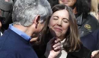 Patti Blagojevich smiles as her husband, former Illinois Gov. Rod Blagojevich touches her chin during a news conference outside his home Wednesday, Feb. 19, 2020, in Chicago, the morning after President Donald Trump on Tuesday, commuted Blagojevich&#39;s 14-year prison sentence for political corruption. (AP Photo/Charles Rex Arbogast)