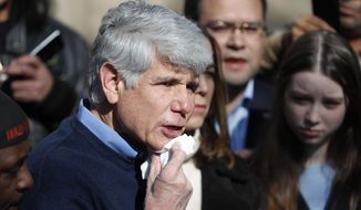 Former Illinois Gov. Rod Blagojevich dabs blood from his chin during a news conference outside his home Wednesday, Feb. 19, 2020, in Chicago. On Tuesday, President Donald Trump commuted Blagojevich&#39;s 14-year prison sentence for political corruption. Blagojevich joked that it was the first time in a long time he has shaved with a normal razor. (AP Photo/Charles Rex Arbogast)