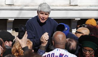 Former Illinois Gov. Rod Blagojevich acknowledges Chicago Cubs&#39; fan Ronnie Woo Woo after a news conference outside his home Wednesday, Feb. 19, 2020, in Chicago. On Tuesday, President Donald Trump commuted Blagojevich&#39;s 14-year prison sentence for political corruption. (AP Photo/Charles Rex Arbogast) ** FILE **
