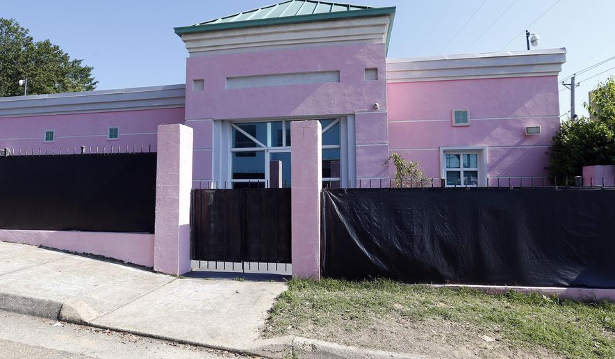 FILE - This Friday, May 17, 2019 file photo shows the Jackson Women's Health Organization in Jackson, Miss. The facility is the state's only abortion clinic. A federal appeals court is keeping a block on a Mississippi law that would ban most abortions at about six weeks, a stage when many women may not even know they are pregnant. (AP Photo/Rogelio V. Solis, File)