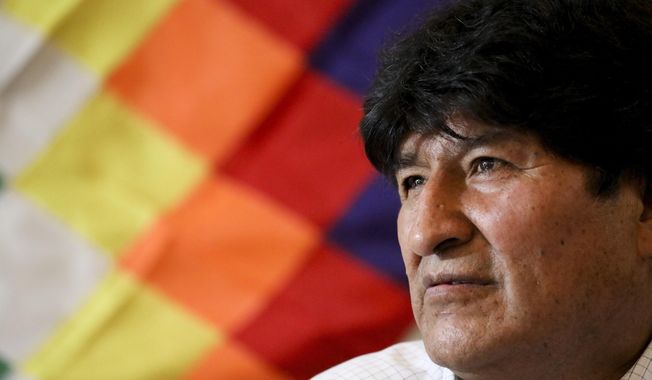 Bolivia&#x27;s former President Evo Morales attends a meeting with members of his political party, the Movement Towards Socialism Party (MAS), in Buenos Aires, Argentina, Monday, Feb. 17, 2020. Bolivia will hold elections on May 3. (AP Photo/Natacha Pisarenko)