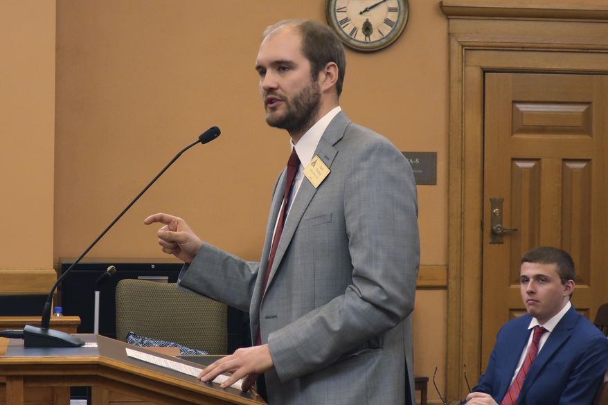 In this Wednesday, Feb. 19, 2020 photo, Zack Pistora, a lobbyist for the Sierra Club, testifies before the Kansas Senate Utilities Committee at the Statehouse in Topeka, Kan. Pistora and other environmentalists are frustrated that the Legislature isn't discussing climate change and considering proposals for combating it. (AP Photo/John Hanna)