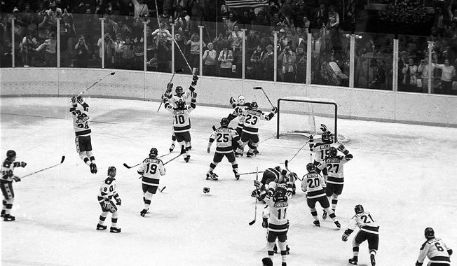 FILE - In this Feb. 22, 1980, file photo, the U.S. ice hockey team rushes toward goalie Jim Craig after their 4-3 upset win over the Soviet Union in a medal round match at the Winter Olympics in Lake Placid, N.Y. Some of the U.S. players shown are Mark Johnson (10); Eric Strobel (19); William Schneider (25); David Christian (23); Mark Wells (15); Steve Cristoff (11); Bob Suter (20) and  Philip Verchota (27).  (AP Photo/File)