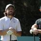 Rory McIlroy of Northern Ireland, right, speaks with Tommy Fleetwood of England as they wait at the second tee off during the first round of the WGC-Mexico Championship golf tournament, at Chapultepec Golf Club in Mexico City, Mexico City, Thursday, Feb. 20, 2020.(AP Photo/Fernando Llano)