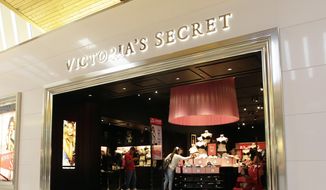 In this June 7, 2017 file photo, shoppers look at merchandise at a Victoria&#39;s Secret store in Hialeah, Fla. (AP Photo/Alan Diaz, File)