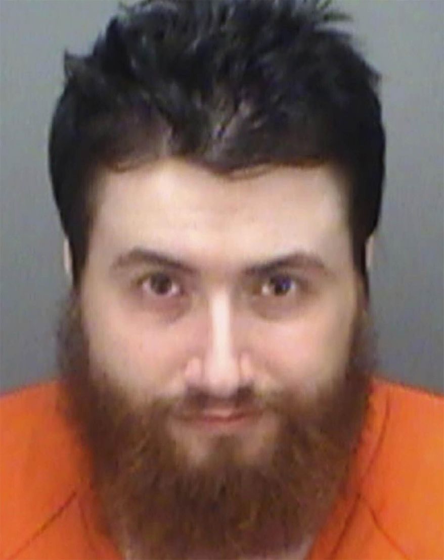 File-This Sept. 18, 2019, file photo provided by the Pinellas County Sheriff's Office shows Daniel McMahon, 31, of Brandon, Fla. McMahon, charged with making racist online threats against a black activist in Virginia, is expected to plead guilty next month, according to court records and a spokesman for federal prosecutors. (Pinellas County Sheriff's Office via AP)