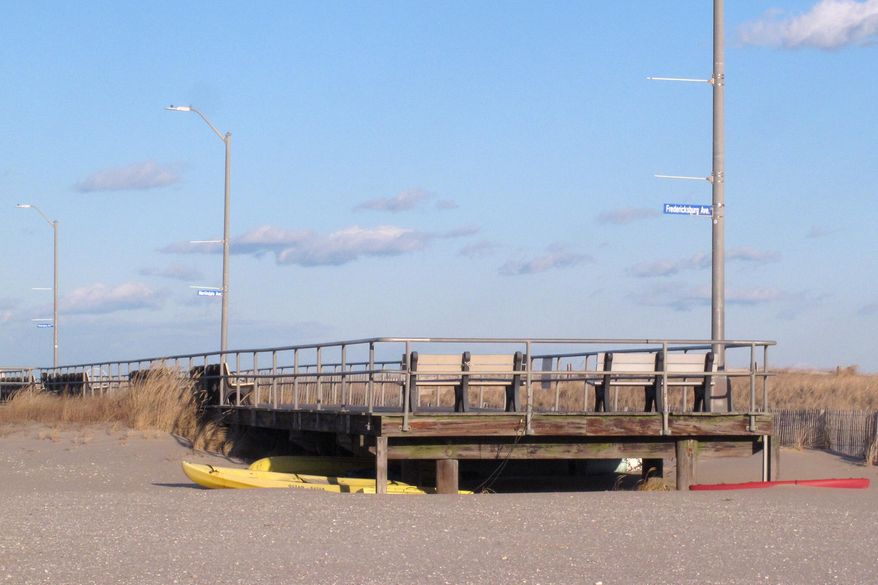 This Jan. 16, 2020 photo shows the end of the Ventnor, N.J. boardwalk as seen from Margate, N.J., where a group of residents wants the city to build its own boardwalk. Proponents of building the boardwalk along the beach in Margate, are accusing the city of using “fear tactics” by claiming a walkway would make it easier for criminals from nearby Atlantic City to commit crimes in the upscale beach enclave. (AP Photo/Wayne Parry)