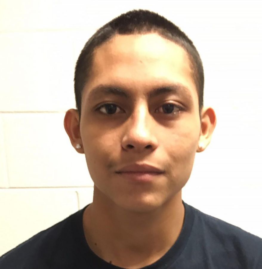 This undated image released by the Montgomery County Police Department, shows Miguel Angel Lopez-Abrego, 19, who is an alleged member of the MS-13 gang involved in the homicide of an unidentified man who was found dead at Wheaton Regional Park in Wheaton, Md. The March 2017 slaying was part of a wave of violence that federal authorities pinned on Maryland-based members of La Mara Salvatrucha street gang, or MS-13 for short. A May 2019 indictment against 22 members and associates of MS-13 "cliques" in Maryland said they were responsible for at least six murders, five attempted murders, a string of assaults, drug trafficking and other crimes. Lopez Abrego, one of those defendants, is scheduled to be sentenced on Friday, Feb. 21, 2020, in Baltimore, in the latest in a flurry of guilty pleas and sentencings in the case. (Montgomery County Police Department, via AP)