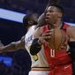Houston Rockets&#39; Russell Westbrook, right, looks to shoot past Golden State Warriors&#39; Eric Paschall in the first half of an NBA basketball game Thursday, Feb. 20, 2020, in San Francisco. (AP Photo/Ben Margot)