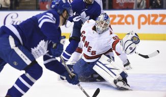 Toronto Maple Leafs left wing Pierre Engvall (47) scores his team&#x27;s third goal of the game against Carolina Hurricanes emergency goalie David Ayres (90) during second-period NHL hockey game action in Toronto, Saturday, Feb. 22, 2020. (Frank Gunn/The Canadian Press via AP)