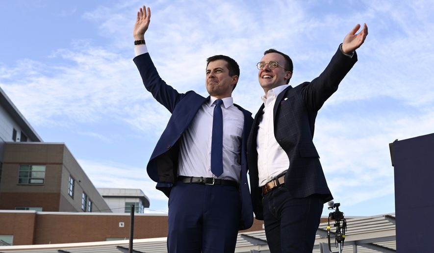 Democratic presidential candidate former South Bend, Ind., Mayor Pete Buttigieg, left, and his husband Chasten Buttigieg, right, wave to the crowd following a campaign event in Arlington, Va., Sunday, Feb. 23, 2020. (AP Photo/Susan Walsh)