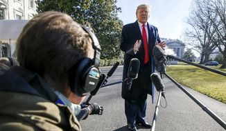 President Donald Trump speaks to the media as he leaves the White House, Sunday, Feb. 23, 2020, in Washington, en route to India. (AP Photo/Jacquelyn Martin)