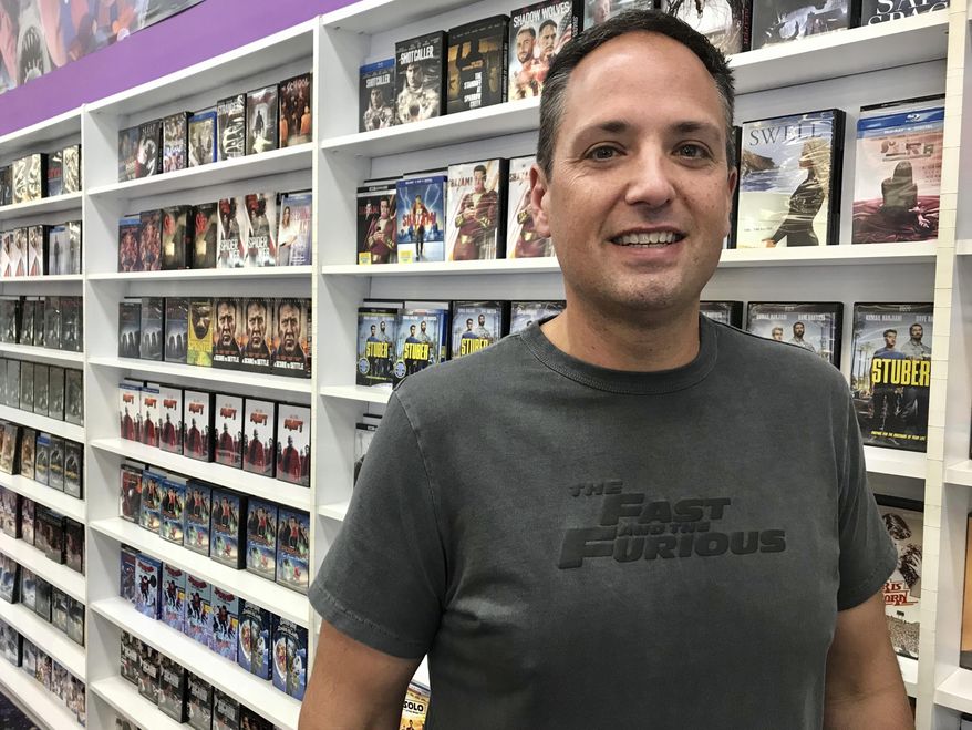 This Feb. 17, 2020 photo shows Steve Chambliss at his family’s National Video Superstore in West Monroe, La. Though consumer spending on home entertainment rose to a record $25.2 billion in 2019, video rental stores accounted for a minuscule $250 million of that amount, according to the Digital Entertainment Group. But somehow Chambliss has maintained a viable, if not booming, business. (Greg Hilburn/The News-Star via AP)