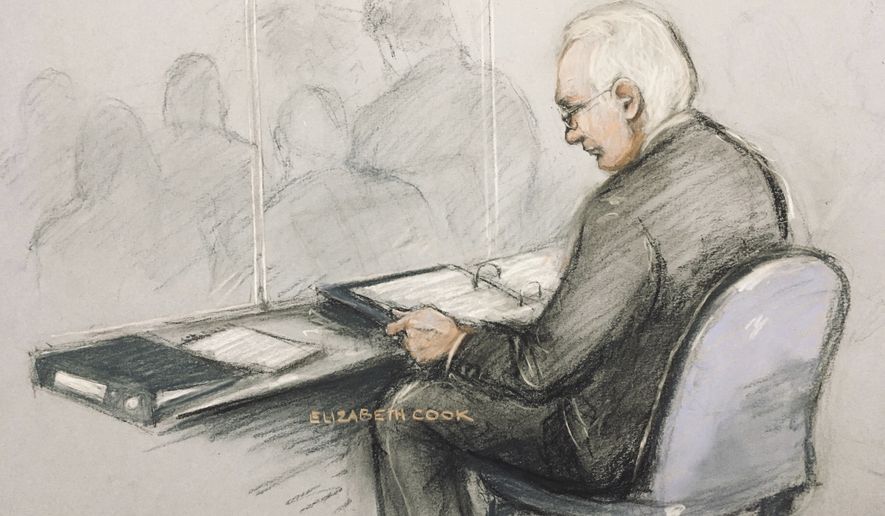 This is a court artist sketch of Wikileaks founder Julian Assange in the dock reading his papers as he appears at Belmarsh Magistrates&#39; Court for his extradition hearing, in London, Monday, Feb. 24, 2020. (Elizabeth Cook/PA via AP)