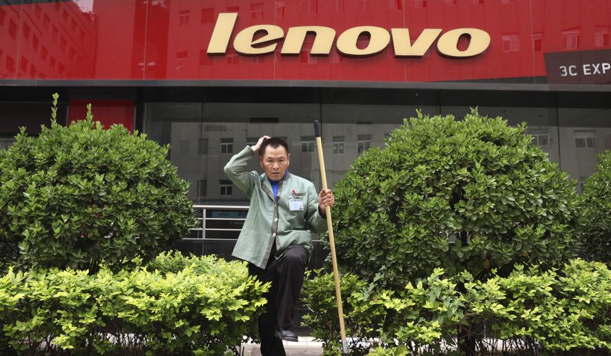 A cleaner works near an empty store of Chinese computer manufacturer Lenovo at a district selling computer products in Beijing, China on Wednesday, May 15, 2019. China&#x27;s factory output and consumer spending weakened in April as a tariff war with Washington intensified, adding to pressure on Beijing to shore up shaky economic growth.(AP Photo/Ng Han Guan)