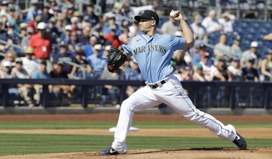 Seattle Mariners' Marco Gonzales throws during the first inning of a spring training baseball game against the Chicago Cubs, Monday, Feb. 24, 2020, in Peoria, Ariz. (AP Photo/Darron Cummings)