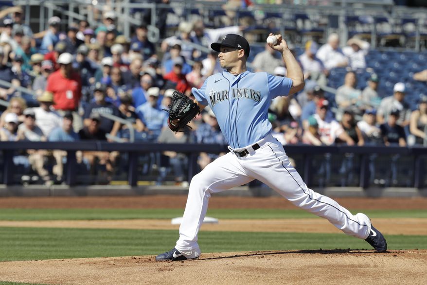 Seattle Mariners' Marco Gonzales throws during the first inning of a spring training baseball game against the Chicago Cubs, Monday, Feb. 24, 2020, in Peoria, Ariz. (AP Photo/Darron Cummings)