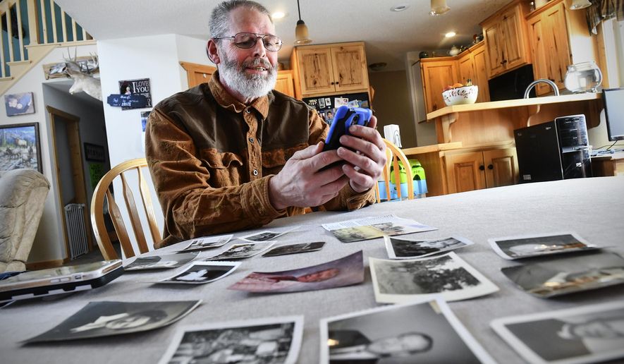 Rick Colbert talks on the phone with Chuck Owen Saturday, Feb. 8, 2020, at his home near Bemidji, Minn. Owen stayed in St. Cloud with Colbert's grandparents 70 years ago. The two were connected after Owen reached out to the community for information on the Colbert family and to thank them for taking him in. (Dave Schwarz/ The St. Cloud Times via AP)