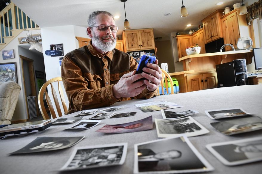 Rick Colbert talks on the phone with Chuck Owen Saturday, Feb. 8, 2020, at his home near Bemidji, Minn. Owen stayed in St. Cloud with Colbert's grandparents 70 years ago. The two were connected after Owen reached out to the community for information on the Colbert family and to thank them for taking him in. (Dave Schwarz/ The St. Cloud Times via AP)
